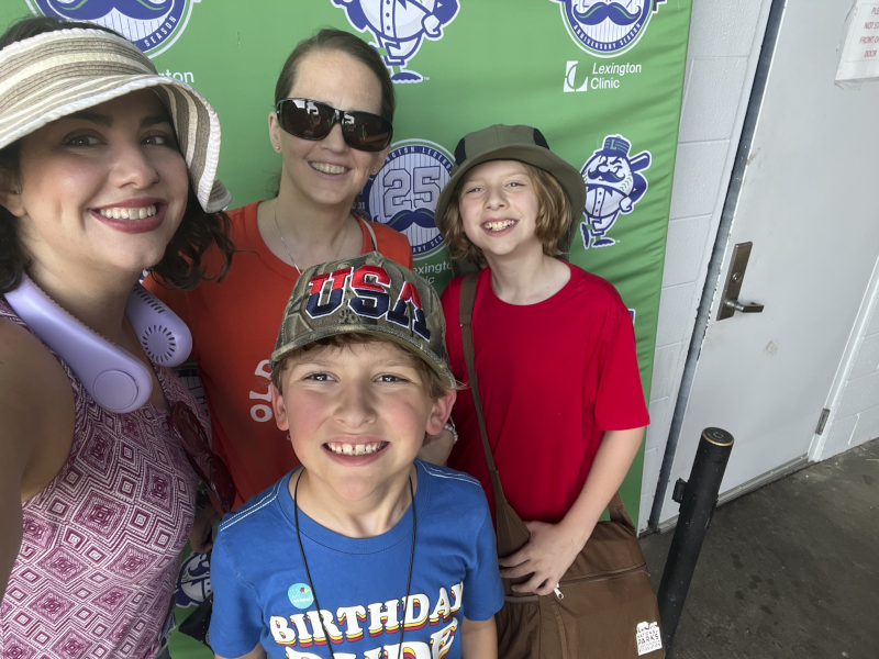 Elizabeth, Natalie, Peter, and Isaac at a Baseball Game